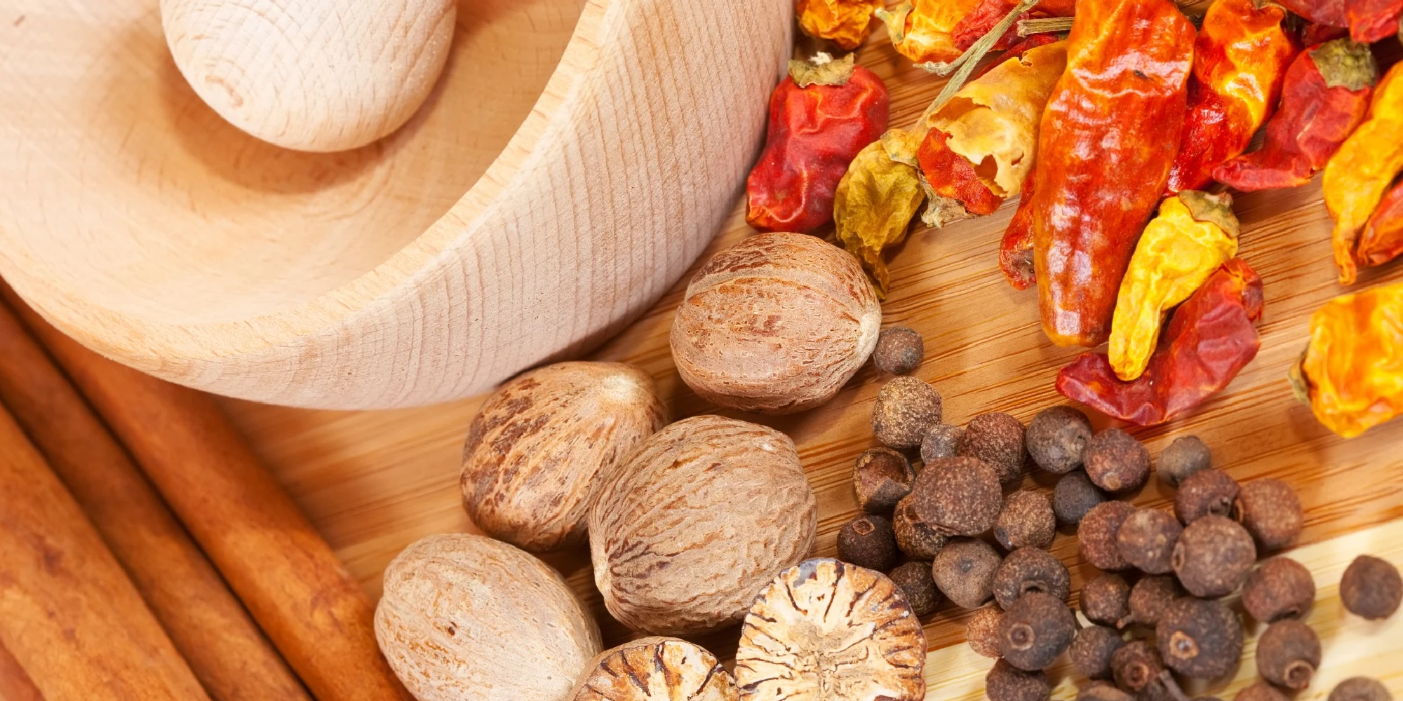 Traditional berbere spice blend in a wooden bowl on Ethiopian cloth